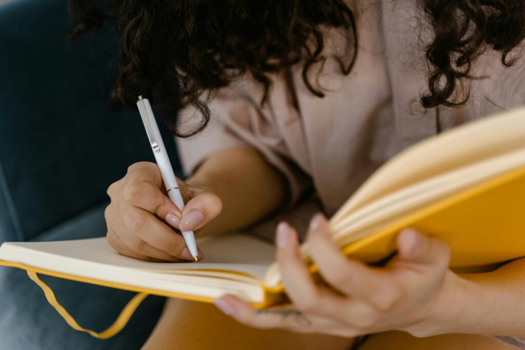 a person writing in a notebook